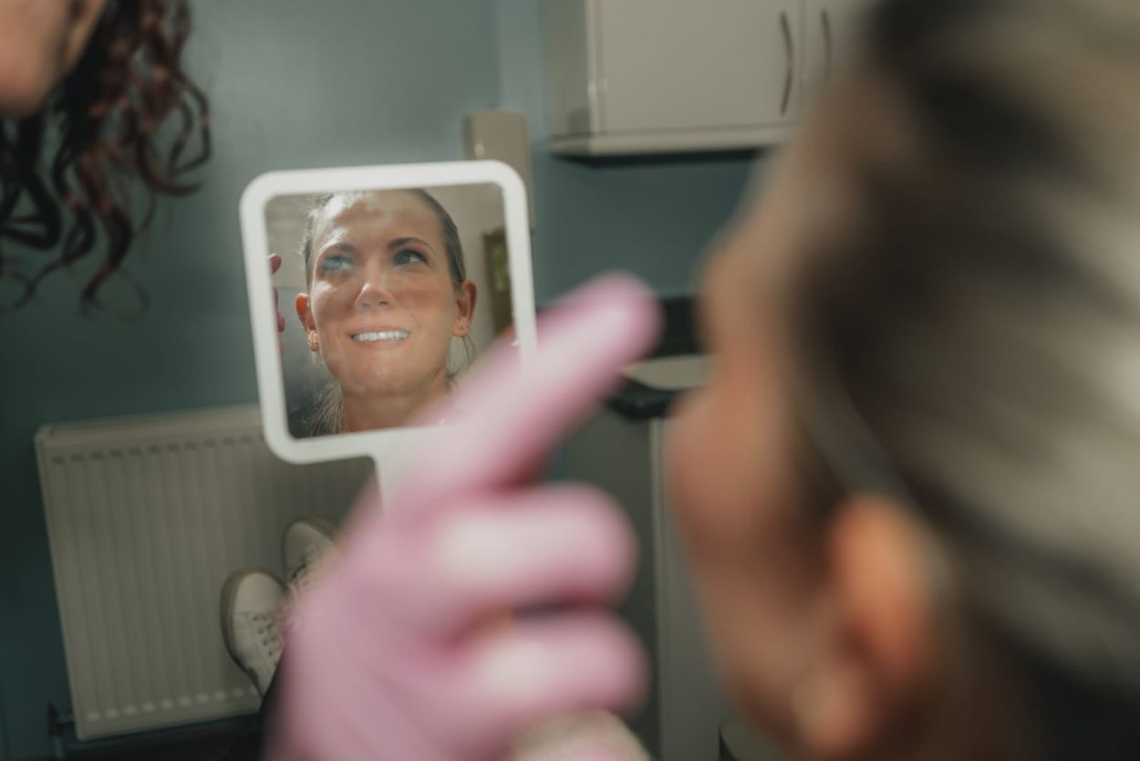 Facial aesthetics practitioner performing a skin treatment at Glendair Dental