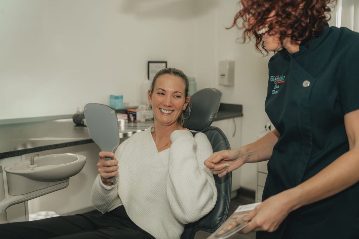 Dentist discussing veneer options with a patient at Glendair Dental