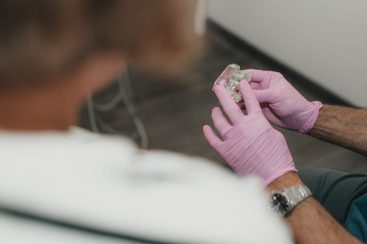 Dentist discussing dental implant treatment with a patient at Glendair Dental